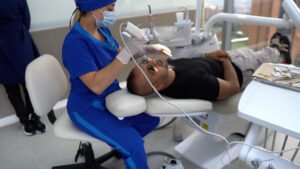 Skilled Colombian dentist performing a complex dental restoration, highlighting the country's advanced dental technologies.